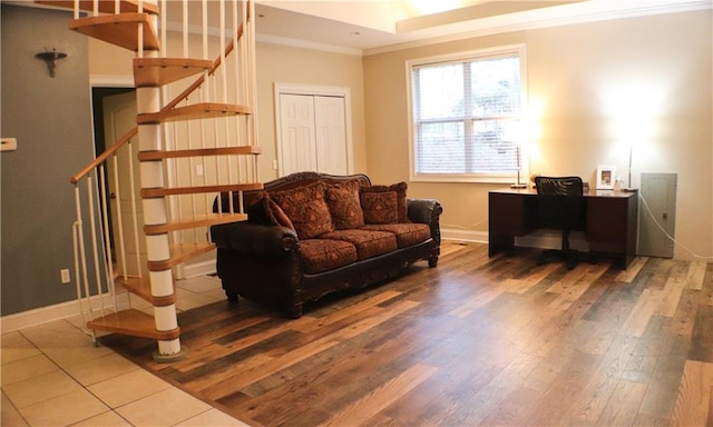 living room with hardwood / wood-style flooring and crown molding