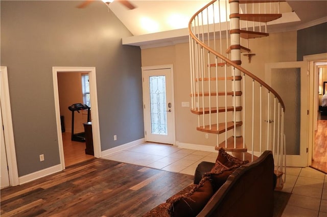 foyer featuring hardwood / wood-style floors and high vaulted ceiling