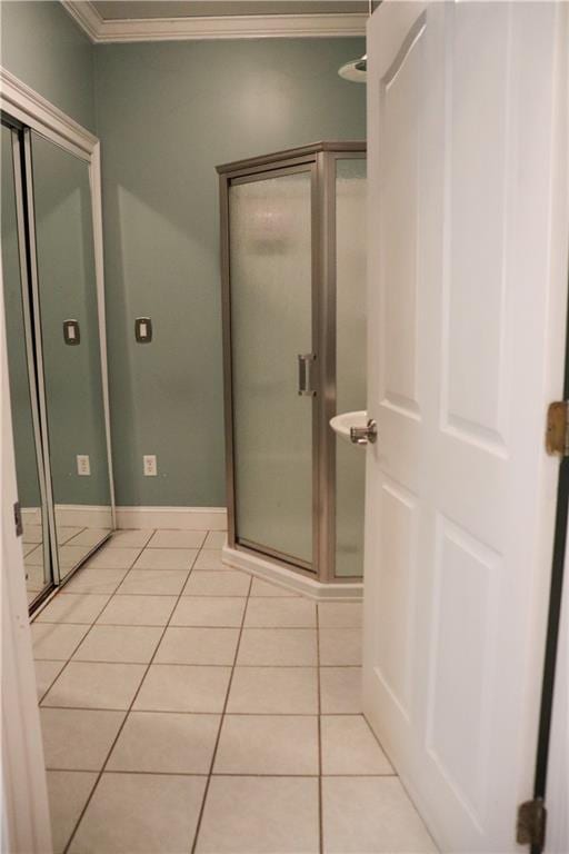 bathroom with tile patterned floors and crown molding