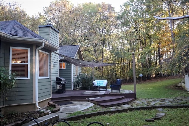 view of yard featuring a deck and an outdoor hangout area