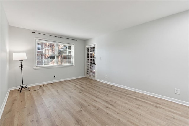 unfurnished room featuring light wood-type flooring