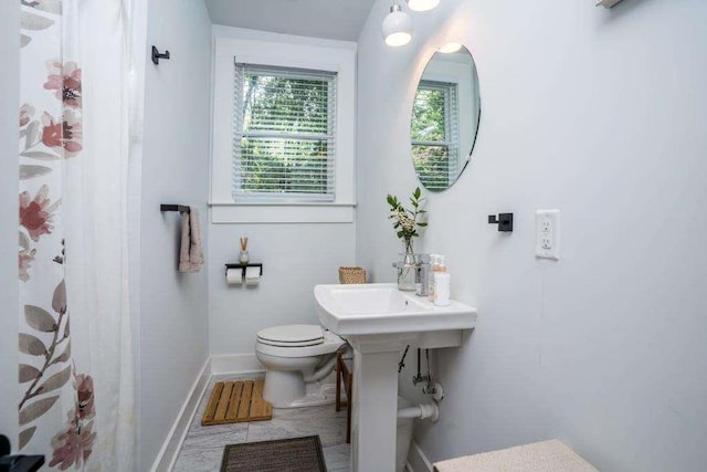 bathroom with tile patterned flooring and toilet