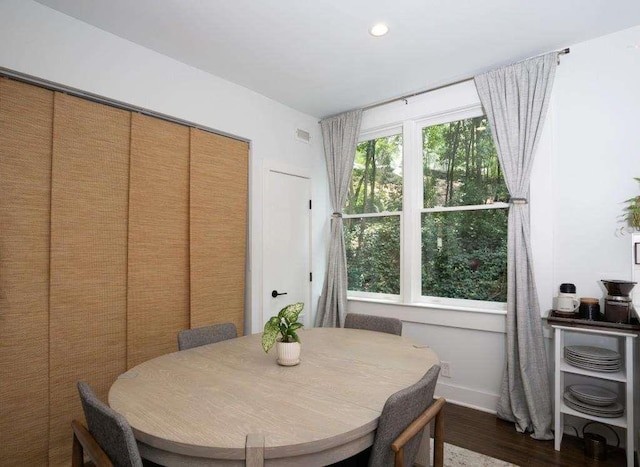 dining space featuring dark hardwood / wood-style flooring