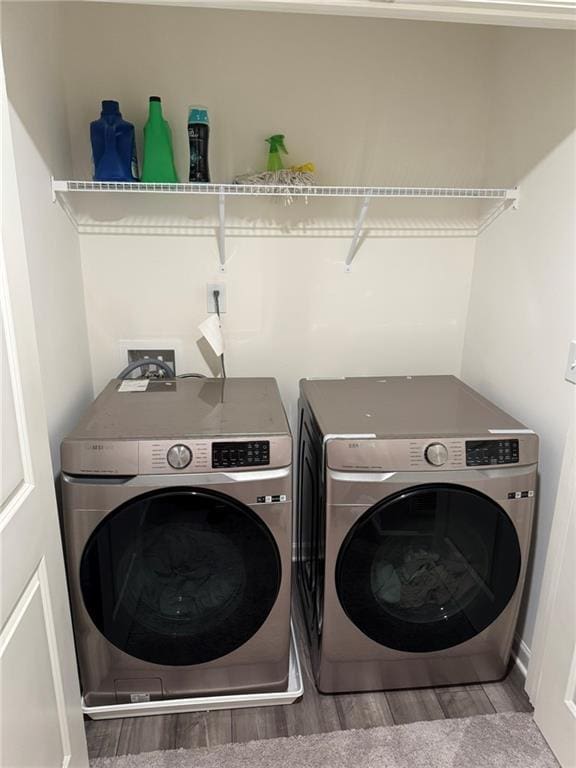 536 Magnolia Cir Unit 116, Palmetto, GA 30268 - laundry area with washing machine and clothes dryer and wood finished floors