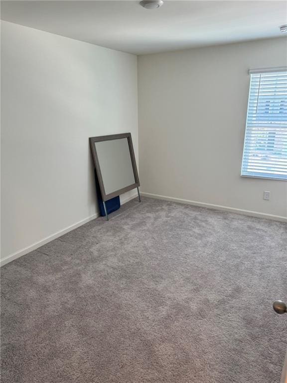 536 Magnolia Cir Unit 116, Palmetto, GA 30268 - carpeted empty room featuring baseboards