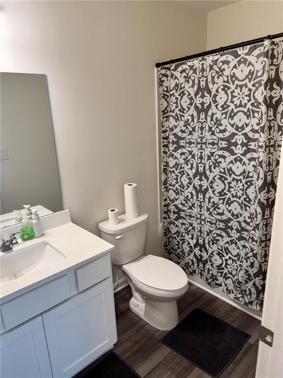 536 Magnolia Cir Unit 116, Palmetto, GA 30268 - bathroom with wood finished floors, vanity, toilet, and a shower with curtain