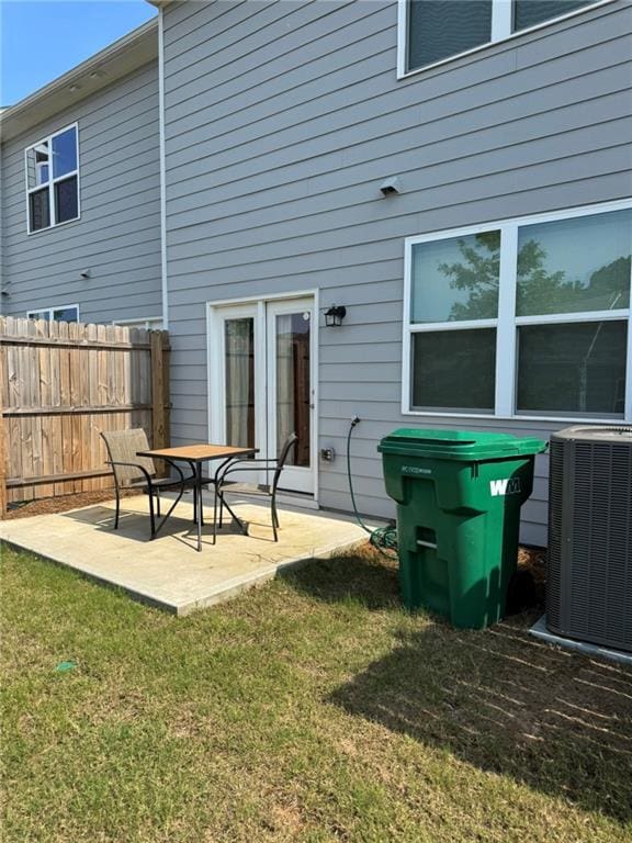 536 Magnolia Cir Unit 116, Palmetto, GA 30268 - back of house featuring central AC and a patio