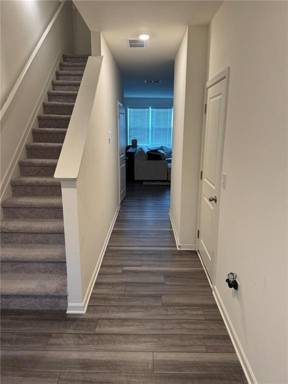 536 Magnolia Cir Unit 116, Palmetto, GA 30268 - hall featuring dark wood finished floors, stairs, and baseboards
