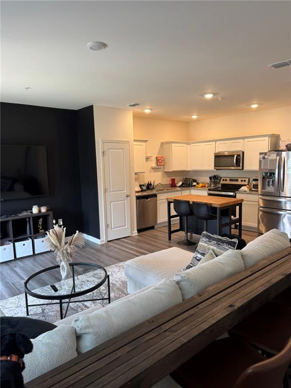 536 Magnolia Cir Unit 116, Palmetto, GA 30268 - living area with wood finished floors
