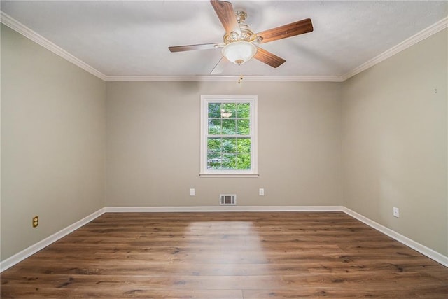 unfurnished room featuring wood finished floors, baseboards, crown molding, and ceiling fan