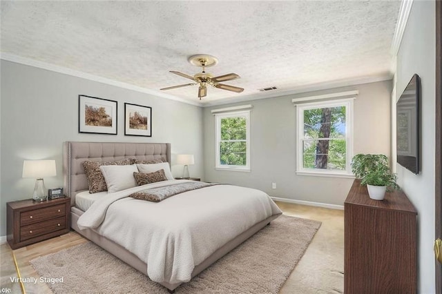 bedroom with ornamental molding, baseboards, a textured ceiling, and ceiling fan
