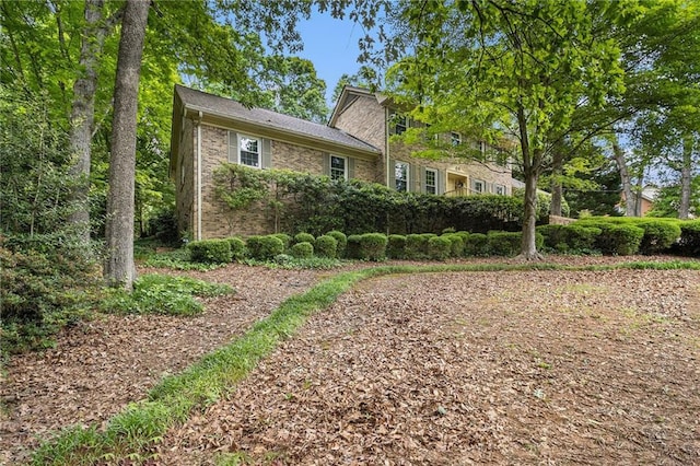 view of property exterior featuring brick siding