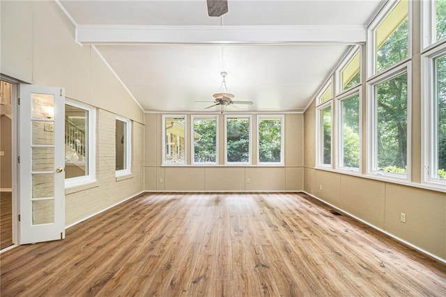 unfurnished sunroom with wood finished floors and a deck