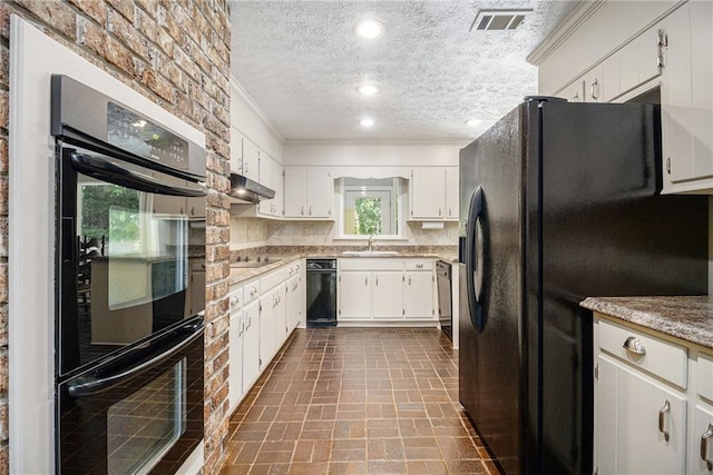 kitchen featuring black appliances, a sink, brick patterned flooring, ornamental molding, and a textured ceiling
