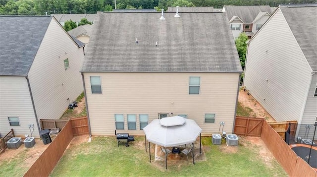 556 Emporia Loop, Mcdonough, GA 30253 - rear view of house featuring central AC unit