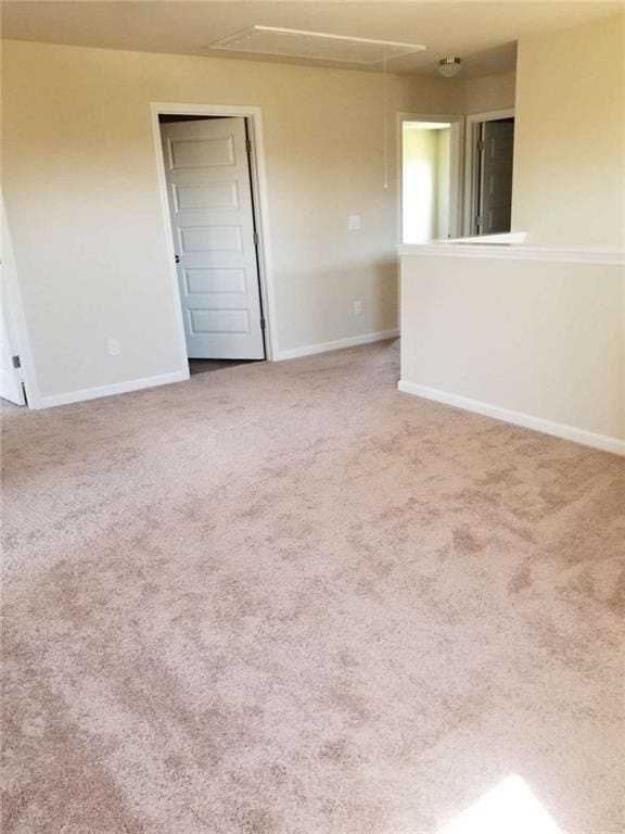 556 Emporia Loop, Mcdonough, GA 30253 - carpeted spare room with attic access and baseboards