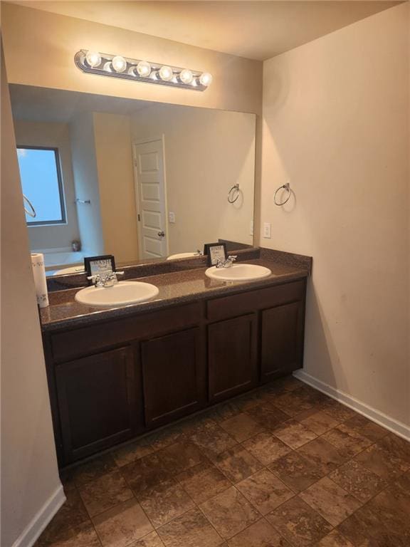 556 Emporia Loop, Mcdonough, GA 30253 - full bath featuring double vanity, baseboards, and stone finish floors