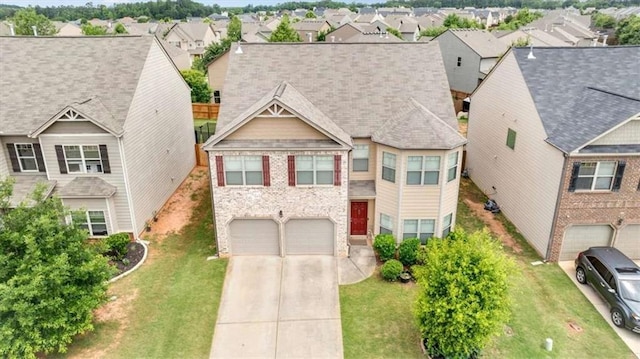 556 Emporia Loop, Mcdonough, GA 30253 - view of front facade featuring a residential view, a garage, concrete driveway, and a front yard