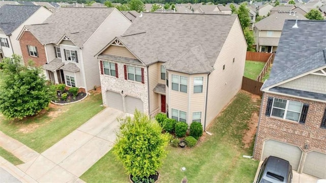 556 Emporia Loop, Mcdonough, GA 30253 - view of front of home featuring an attached garage, a residential view, and concrete driveway