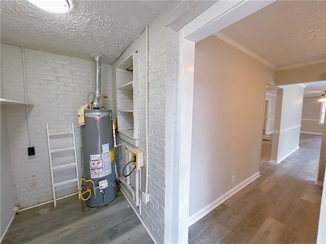 utility room featuring water heater