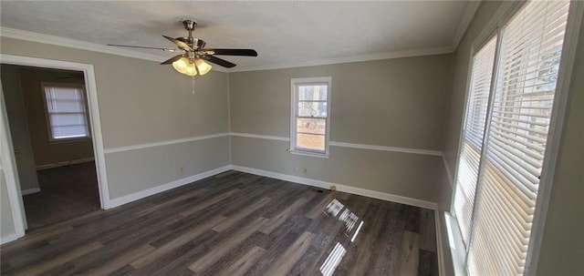 unfurnished room featuring dark wood-style floors, ornamental molding, and baseboards