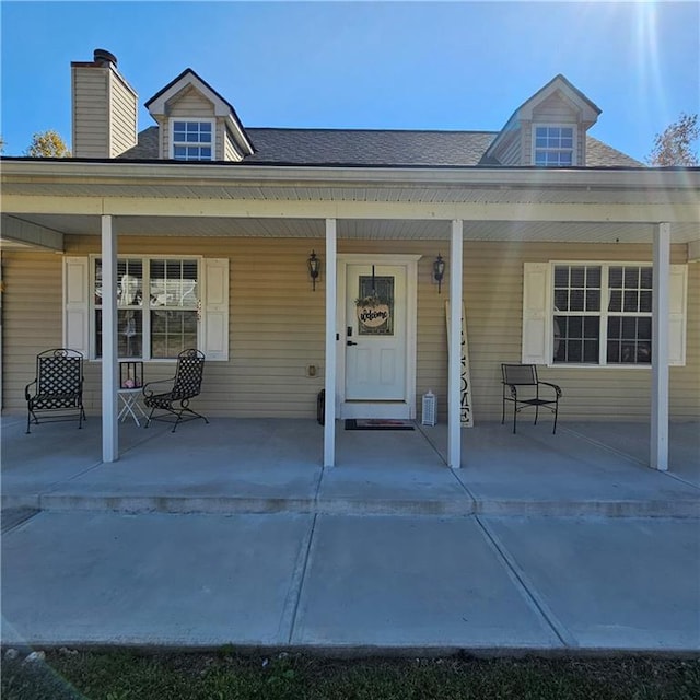 property entrance featuring covered porch