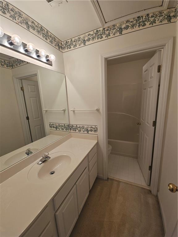 bathroom with toilet and vanity