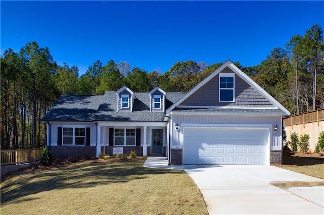 40 Eryn Ter, Covington, GA 30014 - view of front of house with driveway, a garage, roof with shingles, and board and batten siding
