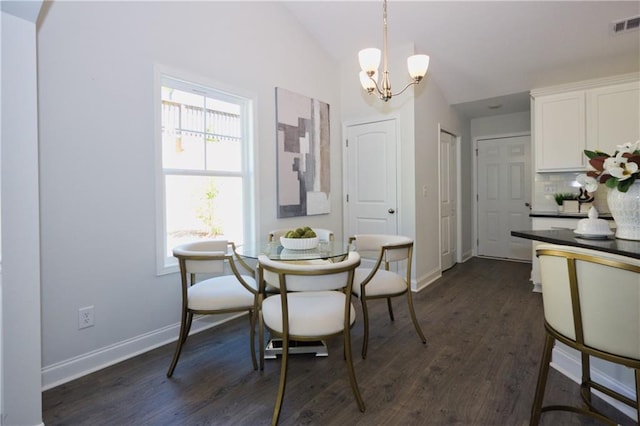 40 Eryn Ter, Covington, GA 30014 - dining space featuring a chandelier, vaulted ceiling, and dark wood-style flooring