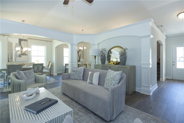 40 Eryn Ter, Covington, GA 30014 - living area with arched walkways, a chandelier, decorative columns, and crown molding