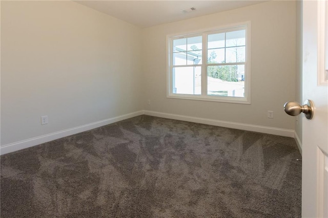 40 Eryn Ter, Covington, GA 30014 - spare room with baseboards and dark colored carpet