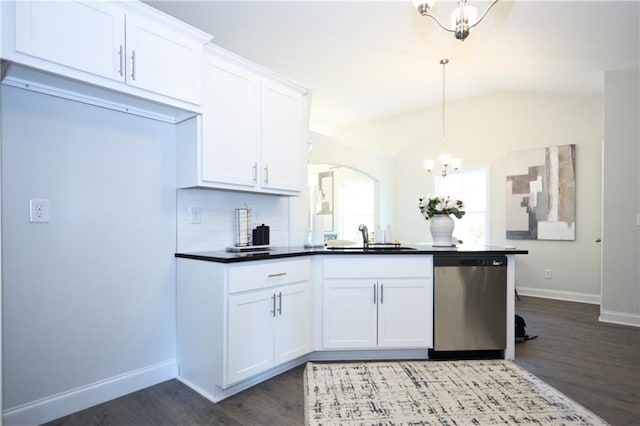 40 Eryn Ter, Covington, GA 30014 - kitchen featuring stainless steel dishwasher, a chandelier, lofted ceiling, dark wood finished floors, and white cabinets