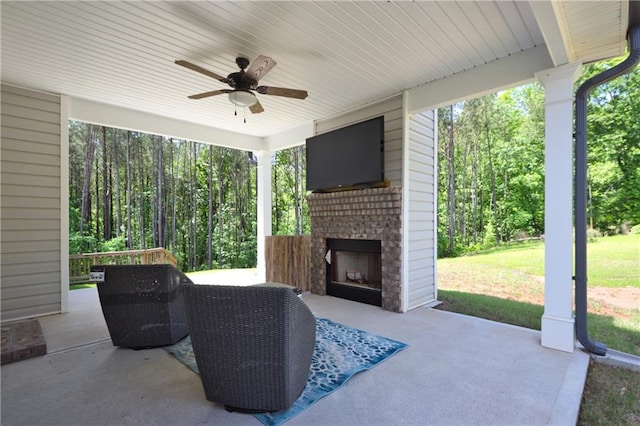 40 Eryn Ter, Covington, GA 30014 - view of patio featuring an outdoor brick fireplace and a ceiling fan
