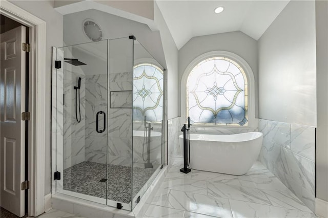 bathroom featuring tile walls, plus walk in shower, and vaulted ceiling