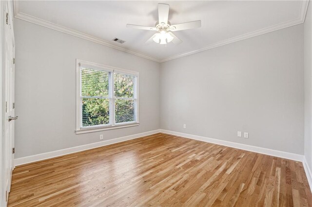 unfurnished room with ceiling fan, ornamental molding, and light wood-type flooring