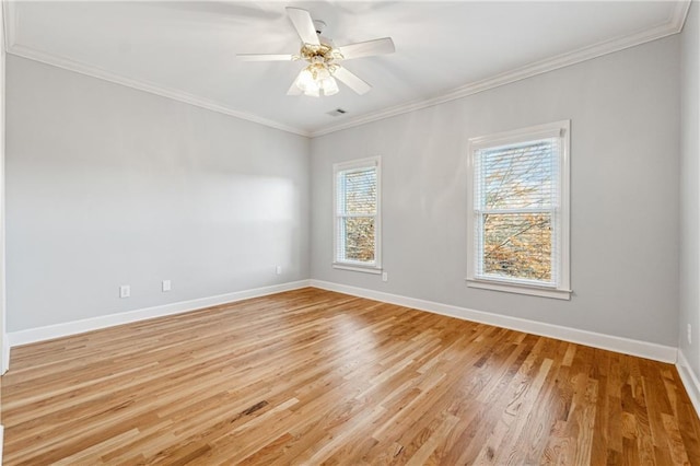 empty room with light hardwood / wood-style flooring, ceiling fan, and crown molding