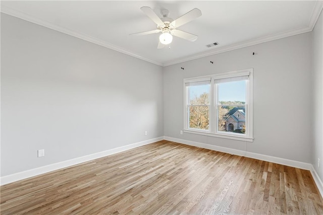 unfurnished room featuring ceiling fan, light hardwood / wood-style floors, and crown molding