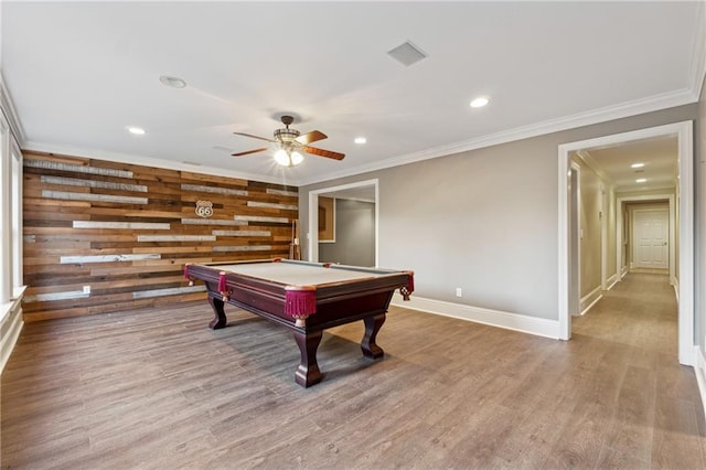 recreation room featuring wooden walls, hardwood / wood-style flooring, ceiling fan, ornamental molding, and pool table