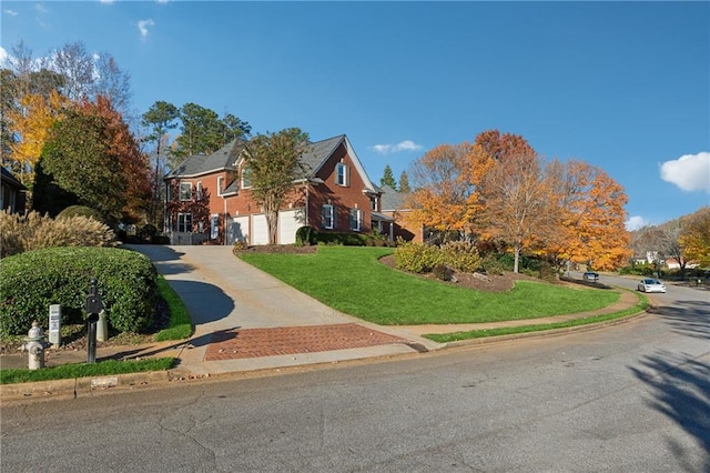 view of front of house with a front lawn and a garage