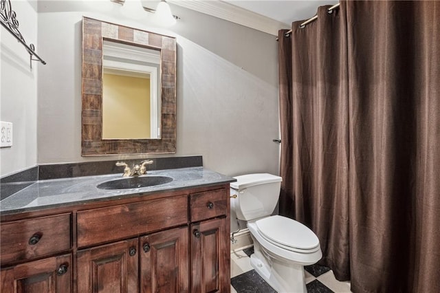 bathroom with vanity, toilet, and crown molding