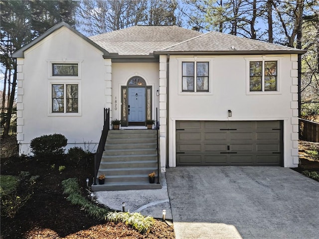 view of front facade featuring stucco siding, driveway, a shingled roof, and a garage