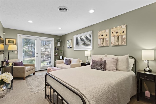 bedroom with visible vents, recessed lighting, french doors, carpet floors, and access to exterior