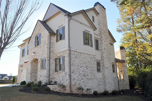 view of side of property featuring a garage