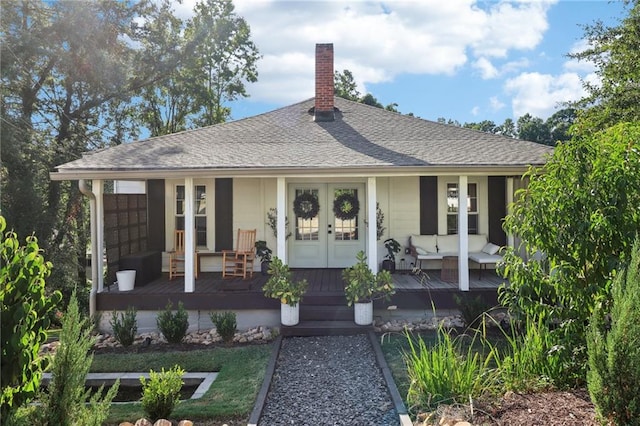 view of front of house with an outdoor hangout area and french doors