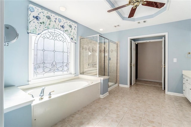 bathroom with a garden tub, vanity, a shower stall, and visible vents