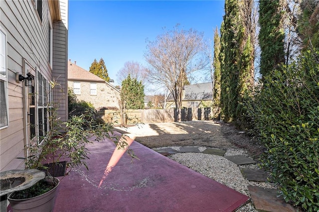 view of yard featuring a patio area and fence