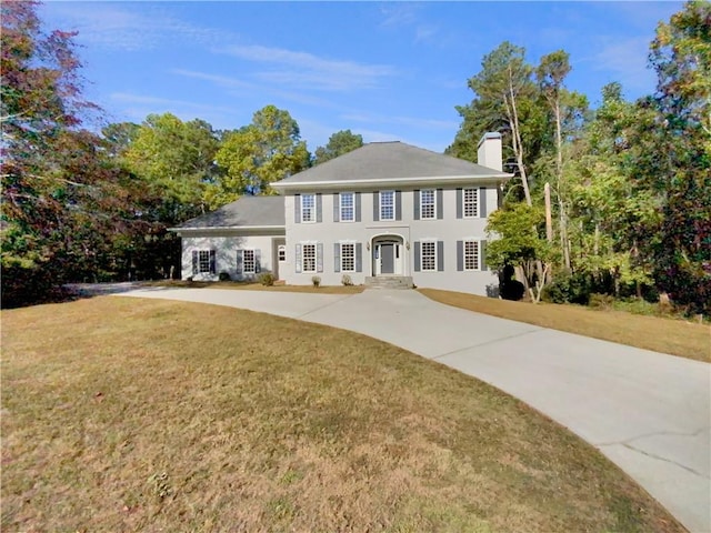 colonial home with a front yard