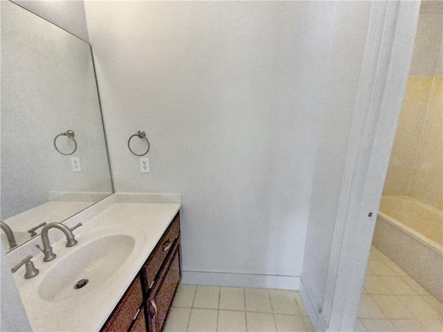 bathroom with vanity, a bathtub, and tile patterned floors