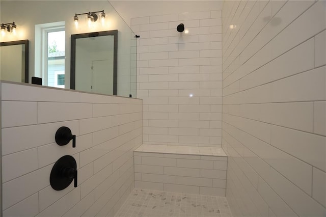 bathroom with a tile shower