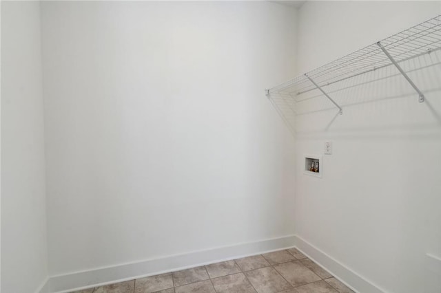 laundry area featuring light tile patterned flooring and washer hookup